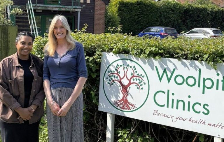 All About Hearing Audiologist, Jenette Jojo-Thomas, standing with Woolpit Clinics owner Tina Pennistone, outside the Woolpit Clinics centre.