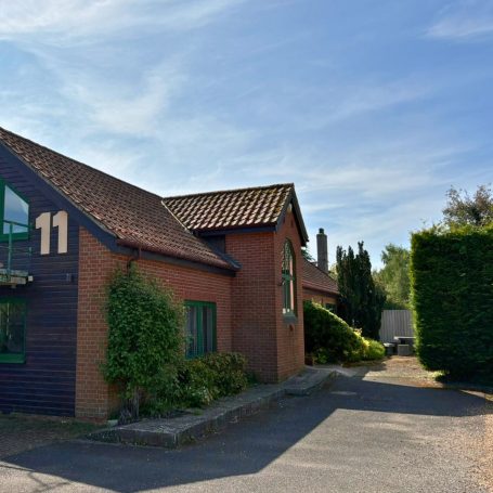 An exterior shot of Woolpit Clinics with a blue sky backdrop