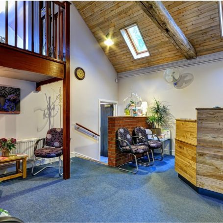 An image showing the warm and welcoming reception area at Woolpit Clinics